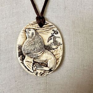 Cream and black carved seal pendant necklace